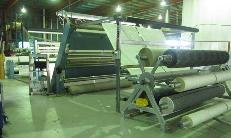 Delta 3 machine inline being fed from powered 6-roll spi-der frame carrying loom rolls.